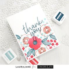 a thank you card and stamp set on a lace doily with the words, thank you