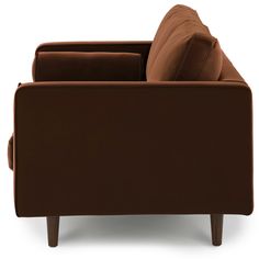 a brown couch sitting on top of a white floor