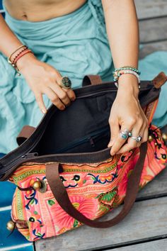 "The beautiful shoulder bag designed by oriental inspiration for lazy days at the beach and wandering around. It is made with an amazing piece of fabric woven by the HMONG hill tribes of Lanna Region (Northern Thailand). It features cotton lining, Leather Straps, a zipper closure and adorned with golden bells. This bag will enhance your appearance. We buy materials from Hmong market and we design and sew by hand. Some of the bags we modify to improve the product. The Hmong tribes live in the Nor Sew By Hand, Northern Thailand, Lazy Days, Beach Tote, Shoulder Bag Women, Fair Trade, At The Beach, Woven Fabric, Hand Sewing