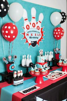 a birthday party with bowling pins and balloons