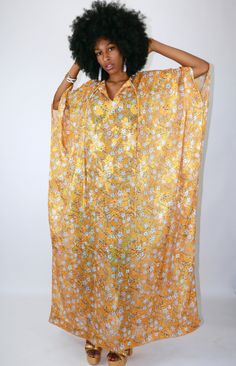 Gorgeous caftan that has lines of sparkle! Slightly see-through chiffon makes this a perfect cover for a swimsuit or a glamorous house dress. *Emorie Jordon original. One of a kind. One Size fits all. Festival Floor-length Beachwear Kaftan, Festive Gold Floor-length Kaftan, Festive Floor-length Kaftan With Gold Embroidery, Yellow Printed Free-size Kaftan, Vibrant Print V-neck Kaftan For Beach Cover-up, House Dress, One Size Fits All, Chiffon