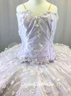 Gorgeous custom made Lt Purple platter tutu with satin corseted bodice and skirt plate. A soft White embroidered sheer mesh covers the Lt Purple satin with small White flowers. Tutu is made from 9 layers of Off-White tulle (hooped). Corset bodice has a size zipper, tutu has hook and eye closures. Costume is decorated with Swarovski rhinestones! Perfect platter tutu for a Lilac Fairy variation! * Almost 5 gross of Swarovski Vitrail Light 16ss rhinestones!! ****Costume is photographed on YM/YL mannequin measuring: Bust 27.5"; Waist 23"; Hips 28.5"**** Fitted Organza Quinceanera Dress, Fitted Ball Gown With Floral Embroidery For Quinceanera, Fitted Organza Quinceanera Ball Gown, Quinceanera Ball Gown With Floral Embroidery And Fitted Bodice, Fitted Quinceanera Dress With Tulle Skirt, Lace Fitted Quinceanera Dress For Pageants, Lace Fitted Quinceanera Dress For Pageant, Fitted Lace Quinceanera Dress For Pageant, Fitted Ball Gown With Attached Cancan For Quinceanera