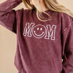 Maroon Corded Sweatshirt - Embroidered - Mom - (Smile) – Little Mama Shirt Shop LLC Relaxed Cotton Tops With Cozy Fit, Trendy Stretch Cotton Sweatshirt, Smiley Face Top For Loungewear, Relaxed Fit Smiley Face Top For Loungewear, Comfy Cotton Tops With Cozy Fit, Trendy Soft-washed Cotton Sweatshirt, Smiley Face Crew Neck Tops For Loungewear, Trendy Oversized Embroidered Sweatshirt, Trendy Smiley Face Loungewear Tops