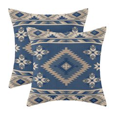 two blue and white pillows on a white background