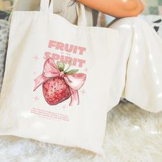 Our Fruit of the Spirit tote is the perfect gift for your favorite Jesus girly who carries all of the things! The design is printed on both sides so you never have to worry about your tote bag facing the right way. Perfect for carrying your bible, bible studies, sermon notes, highlighters, and pens. Made from 100% cotton, this canvas bag is durable and made for everyday use! Scripture-Inspired Design Galatians 5:22-23a "But the fruit of the Spirit is love, joy, peace, forbearance, kindness, good Tote Bag Painting Ideas Christian, Christian Tote Bags Diy, Christian Tote Bags Paint, Christian Tote Bag Design, Bible Study Tote Bag, Church Tote Bag, Bible Tote Bag, Costal Granddaughter, Bag Painting