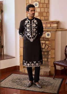 Elevate your style with this striking black kurta, adorned with intricate hand-embroidered mirror work. Made from premium viscose cotton silk, this kurta offers a luxurious feel while providing a smooth, comfortable texture. The delicate mirror work creates a captivating pattern, reflecting light and adding a touch of glamour to any festive occasion. Black Kurta, Reflecting Light, Bespoke Tailoring, Mirror Work, Churidar, Photographic Lighting, Cotton Silk, Hand Embroidered, Elevate Your Style