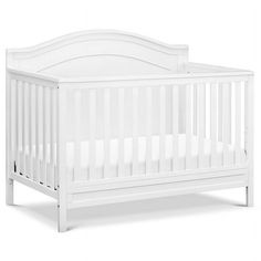 a white crib with no mattress in the front and side rails on the back