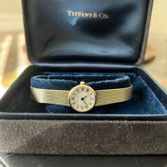 14k Gold Tiffany & Co Ladies 18mm Quartz Watch. This Watch Is Crafted Of 14 Karat Yellow Gold And Features A White Dial, Roman Numeral Hour Markers, Mineral Glass Crystal, And A Quartz Movement. Stamped '14k, 585, Swiss Made Comes With Two Boxes As Shown Recently Serviced And Cleaned At Reiner's Fine Jewelry In Houston. Has A New Battery. Classic Yellow Gold Jewelry And Watches For Anniversary, Luxury Anniversary Watch, Classic Yellow Gold Jewelry For Formal Occasions, Luxury 14k Gold Watch For Formal Occasions, Timeless Yellow Gold Jewelry And Watches For Formal Occasions, Classic Yellow Gold Jewelry For Evening, Timeless Yellow Gold Wedding Jewelry And Watches, Timeless Yellow Gold Jewelry For Wedding, Luxury 14k Yellow Gold Jewelry And Watches