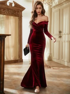 a woman in a red velvet dress