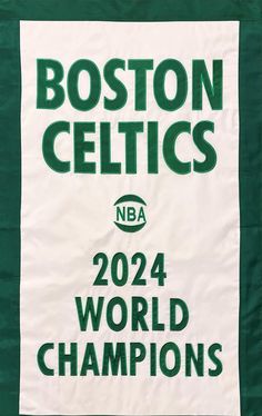 the boston celtic banner is hanging on the wall