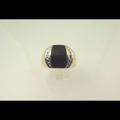 Hi, Here We Have A Beautiful 10k Two Tone Gold Black Onyx With Diamonds Men's Ring. Weight Is 8.7g. Width Is 14.85mm. Ring Has Three Brilliant Round Cut Diamonds On Each Side Of The Black Onyx Totaling Approximately 0.05ct. The Perfect Gift For Your Loved One. Buy With Confidence, We Only Sell Top Quality Items. Comes With A Free Gift Box. Metal: Two Tone Gold (White/Yellow) Main Stone Color: Black Metal Purity: 10k Occasion: Birthday Sizable: Yes Ring Size: 13.5 Main Stone: Onyx Classic Black Rings With Accent Stones, Classic Black Jewelry With Accent Stones, Black Diamond Ring With Accent Stones For Formal Occasions, Formal Black Diamond Ring With Accent Stones, Formal Black Rings With Accent Stones, Formal Black Diamond Ring With Diamond Accents, Black Formal Jewelry With Accent Stones, Black Diamond Rings For Formal Occasions, Luxury Black Jewelry With Accent Stones