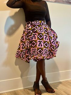 Embrace Africa's bright energy with this gorgeous Ankara wrap skirt. This adaptable item, made of high-quality Ankara cloth, allows for unlimited style options. Whether you like the casual elegance of a maxi, the whimsical appeal of a mini, or the graceful flow of a midi, our wrap skirts are suitable for every style and occasion. The wrap shape offers a great fit for all body types, and the bright Ankara prints lend an exotic flare. Our Ankara wrap skirts are the definition of easy style, whether on a casual day or at a formal event. Discover the charm of African fashion and upgrade your wardrobe now. Features ✨Wrap style, versatile length options, vibrant Ankara prints, comfortable fit. ✨Perfect for: Casual wear, special occasions, office attire. ✨Pair with a simple top and statement acce Traditional Fitted Full Skirt Bottoms, Multicolor Tiered Wrap Skirt With Lining, Traditional Fitted Skirt With Gathered Details, Traditional Fitted Gathered Skirt, Fitted Multicolor Pleated Skirt With Lining, Pink Lined Wrap Skirt With Flared Shape, Multicolor Tiered Lined Wrap Skirt, Traditional Fitted Mini Skirt, Multicolor Flowy Tiered Wrap Skirt