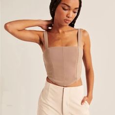 Nwt Cropped Corset Top With Adjustable Straps And Smocked Back For Stretch. Beige Color. So Cute! Never Worn- Brand New! Beige Stretch Chic Crop Top, Chic Beige Stretch Crop Top, Chic Fitted Beige Top, Taupe Fitted Sleeveless Top, Fitted Sleeveless Taupe Top, Fitted Taupe Sleeveless Top, Fitted Beige Crop Top For Summer, Neutral Fitted Cropped Tops, Fitted Beige Trendy Crop Top