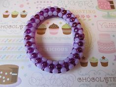 This is a Girls Beaded Bracelet. It would make a cute gift for a little girl's Birthday. They make great Birthday party favors. It has solid purple and dark purple tri beads. It was made with .8mm sturdy stretch string. I tie it several times to prevent breakage. It fits girls ages 5-8. It stretches to fit on the wrist. All items are ready to be shipped I do combined shipping. Items ship in 2-5 business days.  Check out more items at: http://www.etsy.com/shop/MesheleCrafts https://www.facebook.c Pink Beaded Stretch Bracelet For Party Favors, Purple Beaded Bangle Bracelets For Friendship, Birthday Beaded Wristband With Round Beads, Purple Beaded Wristband For Gift, Birthday Beaded Wristband, Purple Beaded Wristband Gift, Pink Round Beads Friendship Bracelets For Party Favors, Pink Round Bead Friendship Bracelets For Party Favors, Purple Beaded Bracelets With Round Beads For Birthday