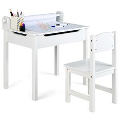 a white desk and chair set up for children's play with colored pencils