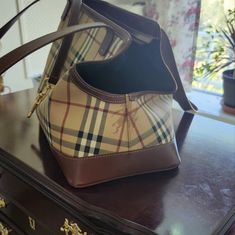 a purse sitting on top of a wooden table