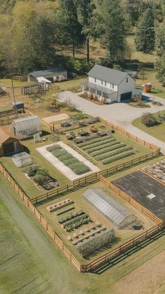 an aerial view of a farm with lots of plants and animals in the yard area