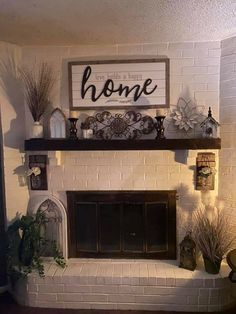 a living room with a fire place and some decorations on top of the fireplace mantel