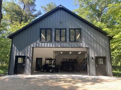 a garage with two cars parked in it