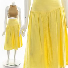 "- 70s Lemon Yellow Gauzy Cotton Midi Skirt - Zipper and Hook and Eye Closure - Natural Raise Waist Fits like:  M-L Material:  Cotton Condition:  Good to Great Clipped on Mannequin:  No ✂ SIZE + FIT ✂ Length: 31\" / 79 cm Waist: 32\" / 81 cm Hips: 50\" / 127 cm All measurements are taken with garment lying flat. ALWAYS refer to measurements as vintage sizes can vary greatly from today's modern sizes. We recommend comparing measurements above with a similar style garment you own for best fit before purchasing.  DRESS FORM / MANNEQUIN is wearing the size detailed above but she typically measures a size 4/6 by modern retail sizes or a general size small. Belt Accessories and other clothes are NOT included. ▲▲All Garments Have Been Laundered/Steamed or Dry Cleaned and are Ready-To-Wear▲▲ Are y Dress Form Mannequin, Cotton Midi Skirt, Good To Great, Skirt Zipper, Cotton Gifts, Beautiful Sweater, Belt Accessories, Dress Form, Lemon Yellow