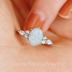 Vintage sterling silver white Opal ring, beautiful promise ring, unique birthday or anniversary gift. Materail: 925 Sterling Silver Main Stone: 6*8 mm Lab Opal Cut: Oval Side stone: CZ CS0456 ✈Free Shipping; 🎁Packaed with beautiful ring box; ★ 30 days return plicy; 🌺Custom service: 👉Stones can be different color, please contact for a custom request; 👉Can also customize with solid gold; 👉Engraving available; Home page:  https://www.etsy.com/shop/CarrieStudio Opal Birthstone Ring In White Gold For Gift, White Opal Ring As A Gift, White Opal Ring For A Gift, Dainty White Gold Opal Ring For Anniversary, White Sterling Silver Birthday Rings, White Sterling Silver Rings For Birthday, White Opal Dainty Birthstone Ring, White Dainty Opal Birthstone Ring, White Opal Promise Ring In Fine Jewelry Style