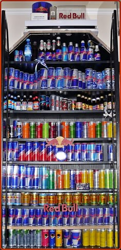 a refrigerator filled with lots of soda cans