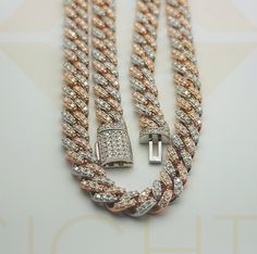 Elevate your style with our luxurious Cuban Link Chain, redefined with a touch of opulence through shimmering rose gold plating and two rows of spectacular moissanite stones. This exquisite piece is crafted over a 14k two-tone rose gold vermeil in pure 925 silver, creating a statement that seamlessly blends sophistication and extravagance. 🌟 **Key Features:** - Luxurious Cuban Link Chain - Shimmering Rose Gold Plating - Two Rows of Spectacular Moissanite Stones - 14k Two-Tone Rose Gold Vermeil Luxury Rose Gold Chain Necklace For Anniversary, Luxury White Diamond Cut Chain Necklace, Luxury White Diamond-cut Chain Necklace, Luxury White Gold Diamond Necklace With Gold Chain, Luxury White Necklaces With Curb Chain, White Curb Chain Necklace Luxury Style, Luxury White Curb Chain Necklace, Rose Gold Diamond Necklace With Chain For Formal Occasions, Formal Rose Gold Diamond Cut Chain Necklace