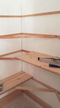 the shelves are made out of plywood and have tools on them for cutting wood