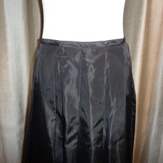 "Striking and stunning long length Black Taffeta Silk Like Skirt which can be dressed up or dressed down and has a classic timeless appeal to it. This is made with 100% Acetate Fabric and is Dry Clean Only. Measurements of this Mint Condition, Never Worn, Long Length Pleated Skirt are as follows: Length: 42\" long Waist: 14.5\" wide, or 28\" all around Hips: 32\" wide or 64\" all around Easy to ship, this will be insured for the price paid against loss and/or damage during transit. Thank you for Long Pleated Silk Skirt, Silk Skirt With Accordion Pleats, Silk Skirt With Accordion Pleats In Full Shape, Silk Long Pleated Skirt With Lining, Long Silk Pleated Skirt With Lining, Fitted A-line Maxi Skirt With Gathered Detail, Fitted Black Skirt With Long Inseam, Black Fitted Skirt With Long Inseam, Fitted Accordion Pleats Skirt For Party