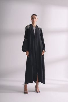 Look elegant and chic in this stunning Zania Floral Maxi Dress in Navy. Perfect for any occasion, this abaya-style dress features a long maxi length with a button front design, creating a sophisticated shirt dress look. The gathered waist and included belt accentuate your waistline for a flattering silhouette. Product Features: - Abaya-style dress for a modest yet stylish look. - Long maxi length for a graceful and elegant appearance. - Button front design for a classic shirt dress look. - Gathe Elegant Long Abaya With Dabka Work, Elegant Abaya With Dabka Work, Formal Abaya With Dabka Work For Eid, Formal Floor-length Embroidered Abaya, Formal Eid Abaya With Dabka Work, Elegant Long Abaya With Dabka Detail, Elegant Long Abaya With Dabka, Long Abaya With Dabka Work For Evening, Formal Long Abaya For Festive Occasions