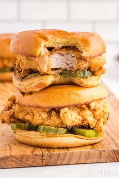 two chicken sandwiches stacked on top of each other