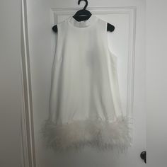 Adorable White Mini, High Neck, With Feather Trim Purchased As An Option For Bridal Activities But Never Ended Up Wearing It. Super Cute, Flirty And Fun! Elegant White Dress With Feather Trim, White Feathered Mini Dress For Cocktails, White Feathered Mini Dress For Cocktail, Formal White Mini Dress With Feather Trim, Elegant White Feathered Dress, Elegant White Mini Dress With Feathers, Chic White Mini Dress With Feather Trim, Chic White Dress With Feathers, Sleeveless White Dress With Feathers