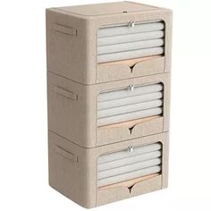 three drawers are stacked on top of each other, one is beige and the other is white