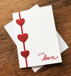 two valentine's day cards with red glitter hearts on them and the words, with love