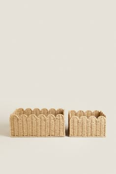 two wicker baskets sitting on top of each other