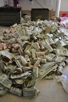 a pile of money sitting on top of a floor