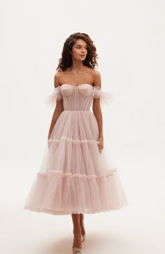 The tulle cocktail dress features a semi-transparent bustier with corset lacing, ruffle sleeves, and a partially lined skirt. Material: Tulle Composition: 100% polyester Skirt length from waist: 35.4 inches Dress weight: 3.52 lbs Neckline: Heart-shaped Back: Lace-up closure Built-in cups Lining: Light blue short underskirt Machine wash gentle cycle up to 86ºF Do not bleach Steam up to 250ºF Dry cleaning allowed Do not tumble dry Dry vertical Store hanging with inner straps on a notched hanger, p Tulle Dress Short, Tulle Cocktail Dress, Bachelorette Theme, Corset Lacing, Pink Tulle Dress, Winter Wedding Guest Dress, Tulle Party Dress, Tulle Midi Dress, Puffy Dresses