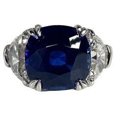 Rare Sapphire Diamond ring in platinum, made with two half moon diamonds with mesmorizing sapphire color center! METAL: PLATINUM NATURAL SAPPHIRE: Carat:4.94ct Cut: Cushion Clarity: Slightly Included Color: Blue NATURAL DIAMOND(S): Clarity/Color: I/G-H Carat:1.31ct Cut:Half Moon Brilliant Grams:9.51 size: 6 Item20000102 ittt WHAT YOU GET AT STAMPAR JEWELERS: Stampar Jewelers, located in the heart of Jupiter, Florida, is a custom jewelry store and studio dedicated to providing 100% satisfaction to each client. Our personal attention to detail, passion, affordability and honesty set us apart from any other store. We will bring full catering of our services to you online through phone calls, consultations and detailed production process. Shopping online can be challenging and we want to help Jupiter Florida, Platinum Diamond Rings, Sapphire And Diamond Ring, Sapphire Color, Sapphire Diamond Ring, Platinum Ring, Stunning Jewellery, Natural Sapphire, Sapphire Diamond