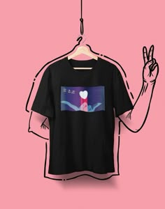 a t - shirt hanging on a hanger with an image of a person's hand making the peace sign