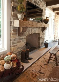 a living room filled with furniture and a fire place