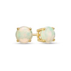 Simple and chic, these gemstone stud earrings add color to any style. Fashioned in warm 10K gold, each earring showcases a 6.0mm iridescent opal cabochon solitaire. Buffed to a brilliant luster, these post earrings secure comfortably with friction backs. Formal Opal Round Earrings, Formal Round Opal Earrings, Classic Opal Jewelry With Round Cut, Classic Round Cut Opal Jewelry, Opal Earrings Stud, Solitaire Studs, Gemstone Stud Earrings, Opal Studs, Gemstone Studs