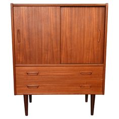 a large wooden cabinet with two drawers on one side and an open drawer on the other