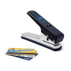 a stapler and some credit cards on a white background