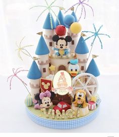 there is a cake that looks like it has been made to look like mickey mouse's castle