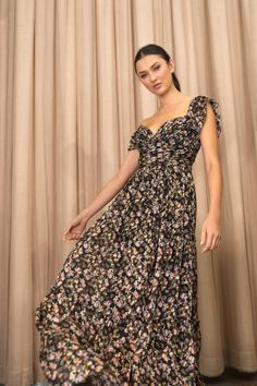 The Naia dress makes a beautiful statement for any special occasion. Cut in our beautiful new silk blend Topiary floral burnout fabric, she features a deep sweetheart neckline and versatile ruffle sleeves that can be worn on or off the shoulder. Pleating details in the structured bodice and gathered tiers in the skirt add further interest to this striking style. Details: - Topiary Floral Burnout fabric- Deep sweetheart neckline- Bust cups- Boning- Ruffled strap can be worn on or off the shoulder Burnout Fabric, Jenny Yoo, Wedding Guest Dresses, Ruffle Sleeves, On Or Off, Guest Dresses, Sweetheart Neckline, Black Floral, Dress Making