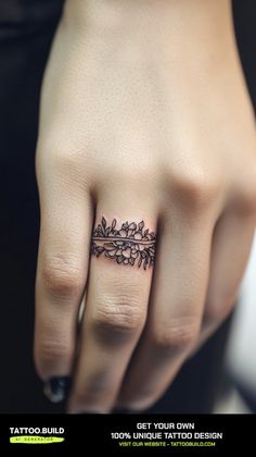 a woman's hand with a tattoo on it