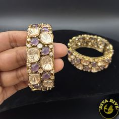 This stunning piece, adorned with radiant moissanite stones, adds a touch of luxury and sparkle to your look. Perfect for any occasion! 💎 Quality Guaranteed Metal: Brass Nickel Free Polish : Mehndi Gold Openable Handmade Comes in Pair Elegant Jeweled Bracelets For Diwali, Elegant Bangle For Diwali Gift, Elegant Kundan Jeweled Bracelets, Fusion Style Hand Set Bangle As A Gift, Elegant Bangle For Formal Diwali Events, Fusion Style Hand Set Bracelets For Diwali, Fusion Hand Set Bracelets For Diwali, Fusion Style Hand-set Bracelets For Diwali, Hand-set Fusion Style Bracelets For Diwali