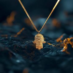 Elevate your style with our 14k Gold Hamsa Hand Pendant. This solid gold necklace showcases exquisite craftsmanship, symbolizing protection and blessings. The 14 karat gold Hamsa Hand pendant is more than just jewelry; it's a fine representation of symbolism and cultural significance, also available in 18k yellow gold. PENDANT INFORMATIONThis pendant is made of real, solid gold.• Made in USA• Material: 14k or 18k solid gold• Finish: polished• Height: 1.25" (31,5 mm) x Width: 0.95" (24 mm)• Penda Symbolic Yellow Gold Necklace With Large Pendant, Symbolic Bronze Jewelry For Rituals, Yellow Gold Locket Charm Necklace Amulet Style, Yellow Gold Locket Charm Necklace, Symbolic Bronze Pendant Jewelry, Traditional 14k Gold Necklace With Intricate Design, Spiritual Tarnish-resistant Round Pendant Charm Necklace, Engraved Pendant Jewelry For Rituals, Good Luck Amulet Jewelry With Round Pendant