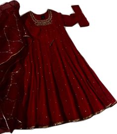 a red dress with gold sequins on it