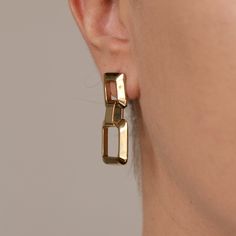 Details: Stainless steel. Water resistant. Trendy Formal Stainless Steel Jewelry, Everyday Metal Earrings With Polished Finish, Modern Gold-tone Metal Hoop Earrings, Everyday Stainless Steel Earrings, Yellow Gold Box Chain Earrings, Trendy Rectangular Metal Jewelry, Modern Stainless Steel Hoop Earrings For Pierced Ears, Trendy Polished Metal Earrings, Trendy Metal Earrings With Polished Finish